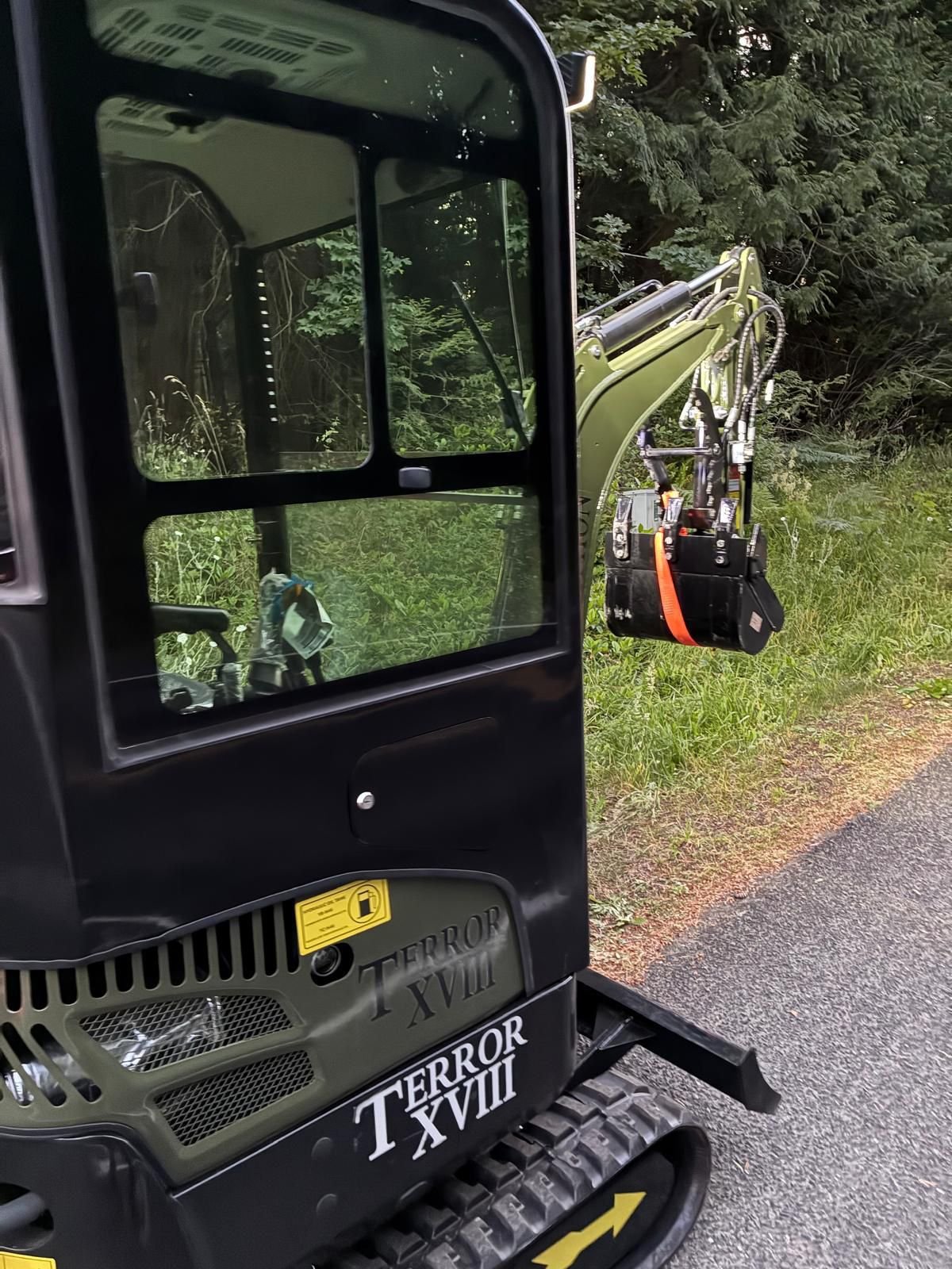 Black TYPHON TERROR XX enclosed-cabin mini excavator